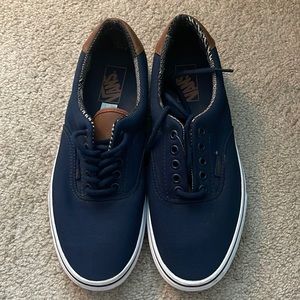Blue never worn Vans shoes. Men’s 9.5, women’s 11.0